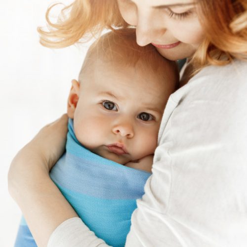 close-up-sweet-little-baby-boy-with-his-big-grey-eyes-mom-snuggle-her-child-with-tenderness-love-family-concept_176420-12235